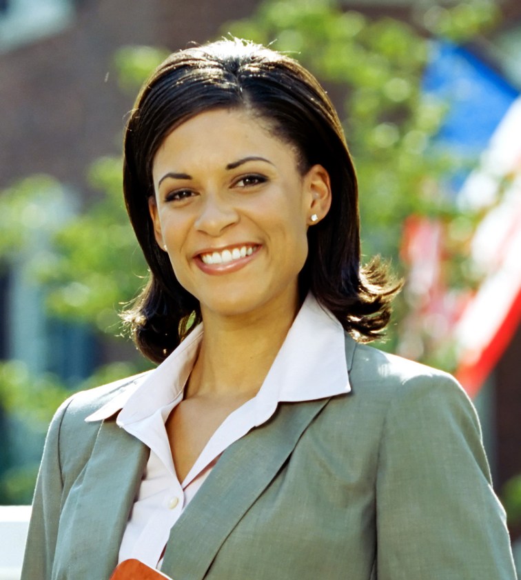 An image of a smiling woman. 