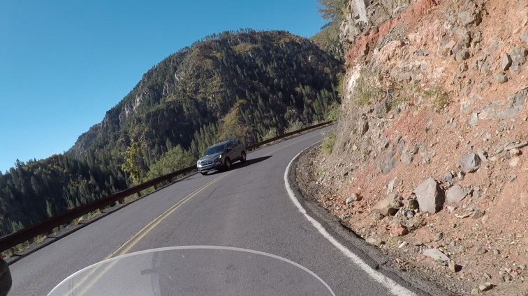 POV riding a motorcycle in Oak Creek Canyon.