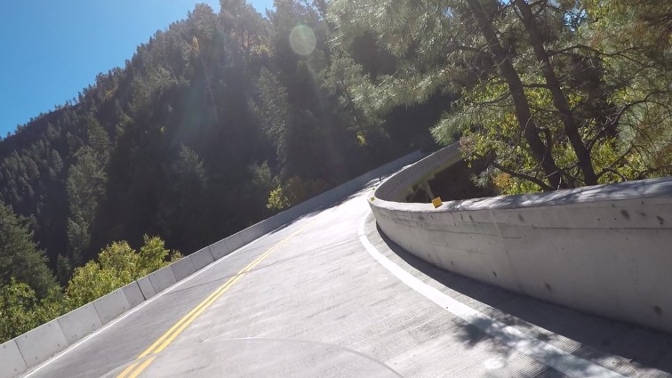 POV riding a motorcycle in Oak Creek Canyon.
