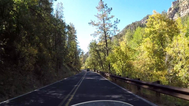 POV riding a motorcycle in Oak Creek Canyon.