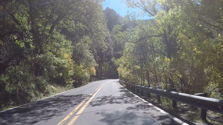 POV riding a motorcycle in Oak Creek Canyon.