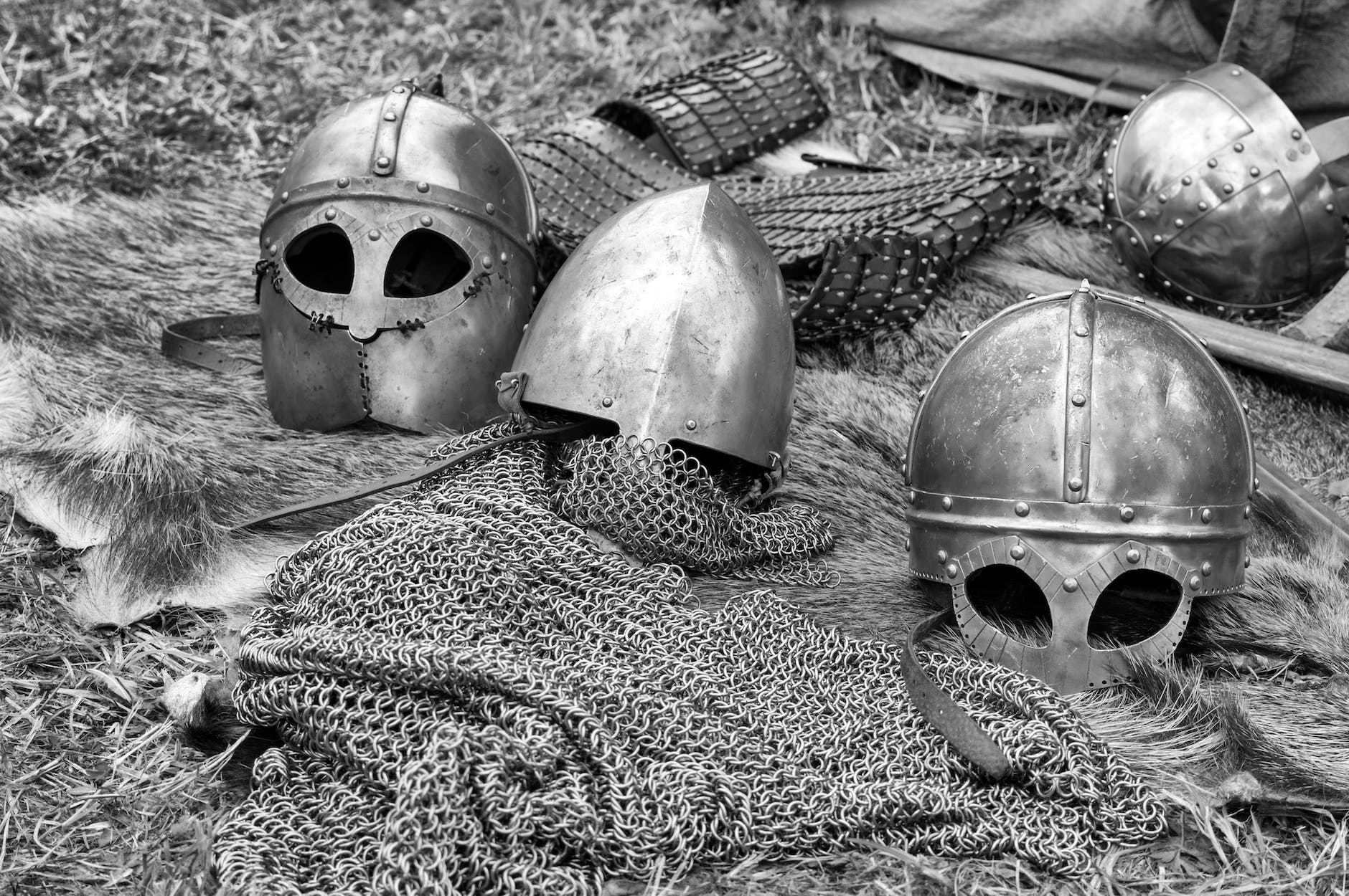An image of the helmets and chain mail armor of ancient warriors. 