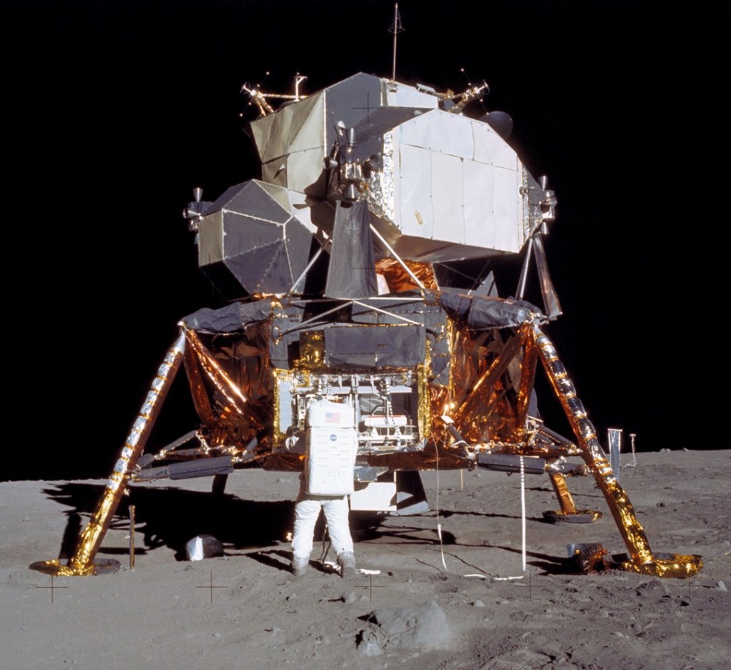 An astronaut standing outside the lunar module purportedly on the surface of the moon. 