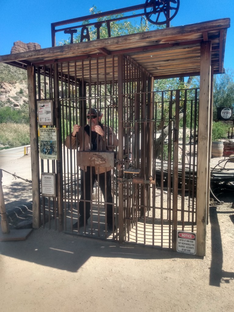 The Author, Daniel Wolfert is seen in a jail cell from the days of the "Old West".